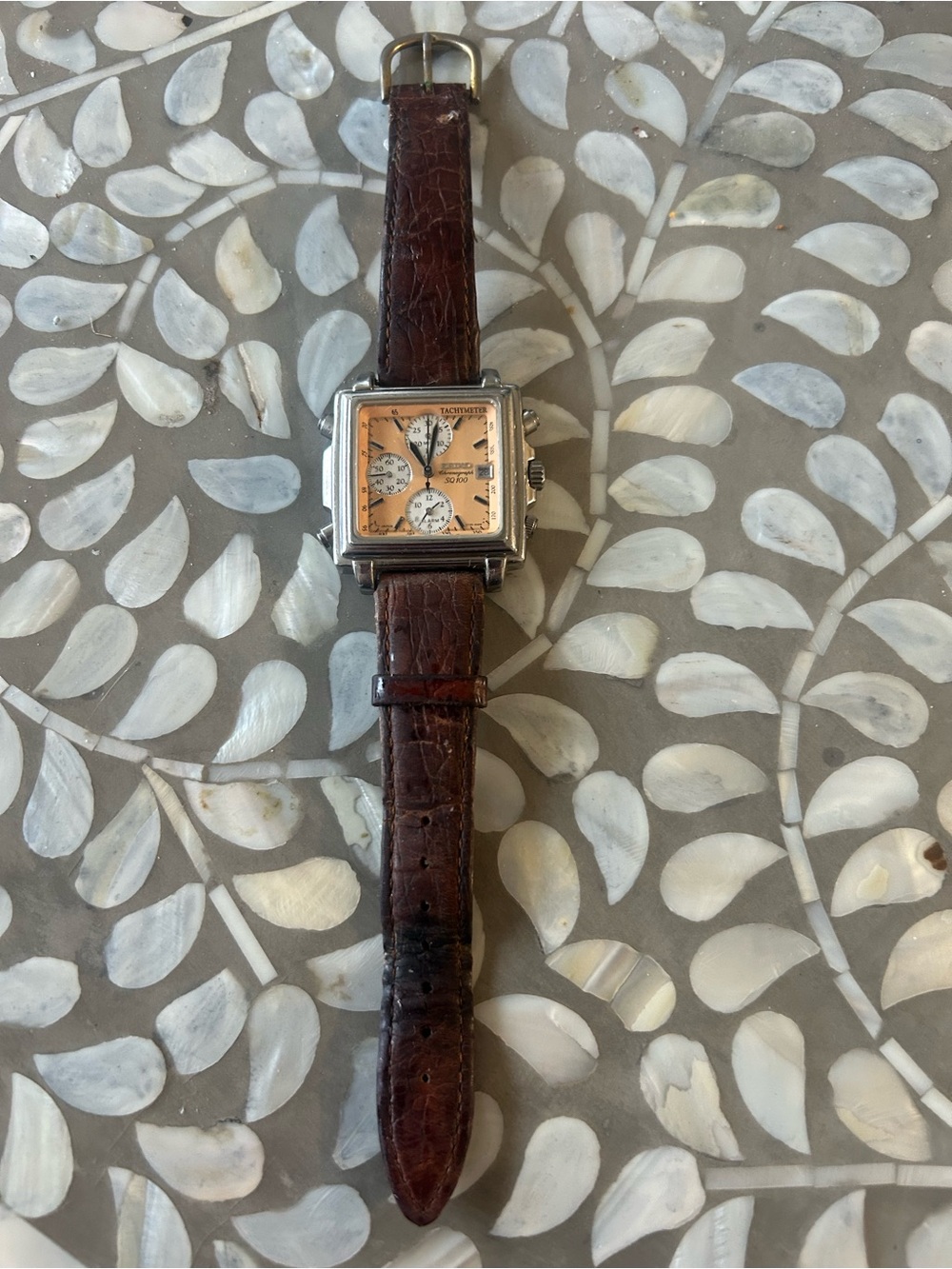 Seiko SQ 100 vintage watch with brown leather band